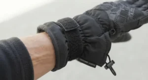 Detail shot of the secure elastic wrist cuff on budget waterproof winter work gloves to keep out cold wind and debris.